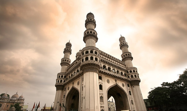 The Charminar in Hyderabad rising against a dramatic sunset sky